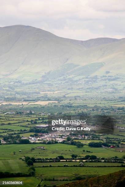 elevated view of irish village in green valley - verwaltungsbezirk county limerick stock-fotos und bilder