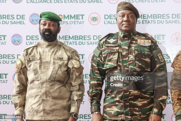 The head of head of Niger's military government General Abdourahamane Tiani and Malian Colonel Assimi Goita pose for a photo as they arrive ahead of...