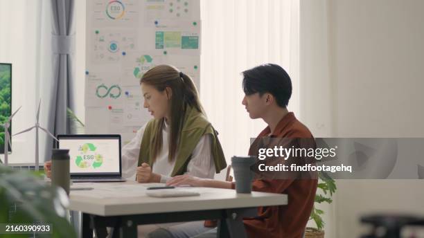 professionals discussing renewable energy esg goals. - sustainable business stock pictures, royalty-free photos & images