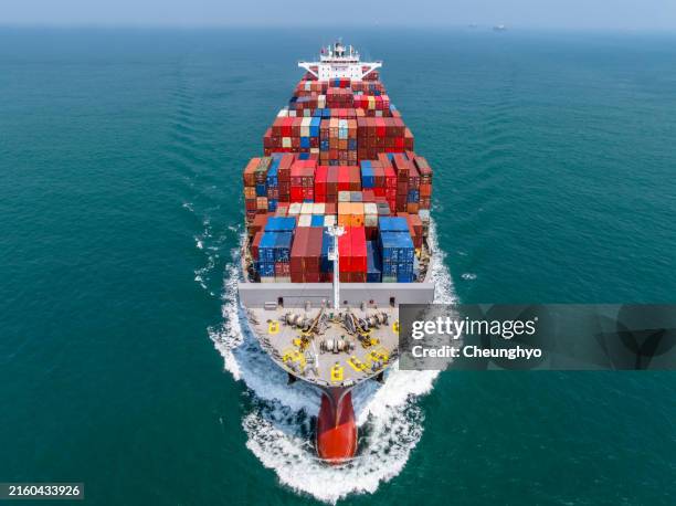 close - up: drone aerial view of a large cargo ship in qingdao, shandong, china - container ship bow stock pictures, royalty-free photos & images