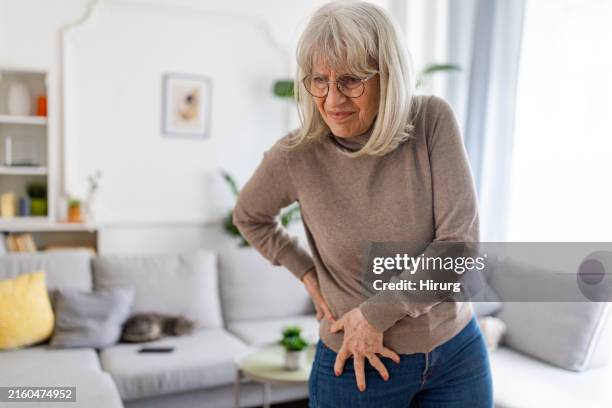 senior woman has a pin in hip - hip body part stock pictures, royalty-free photos & images