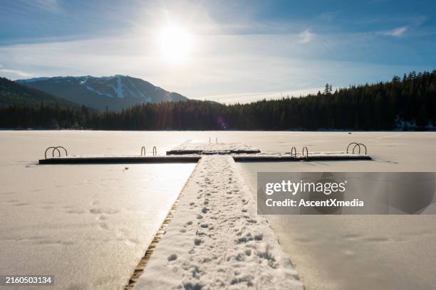 pier over lake in winter - lost lake stock pictures, royalty-free photos & images