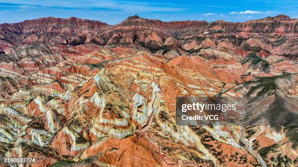 Aerial view of the breathtaking natural scenery of the Lanzhou Shuimo Danxia Scenic Area, is known as the "golden treasure house of tourism...