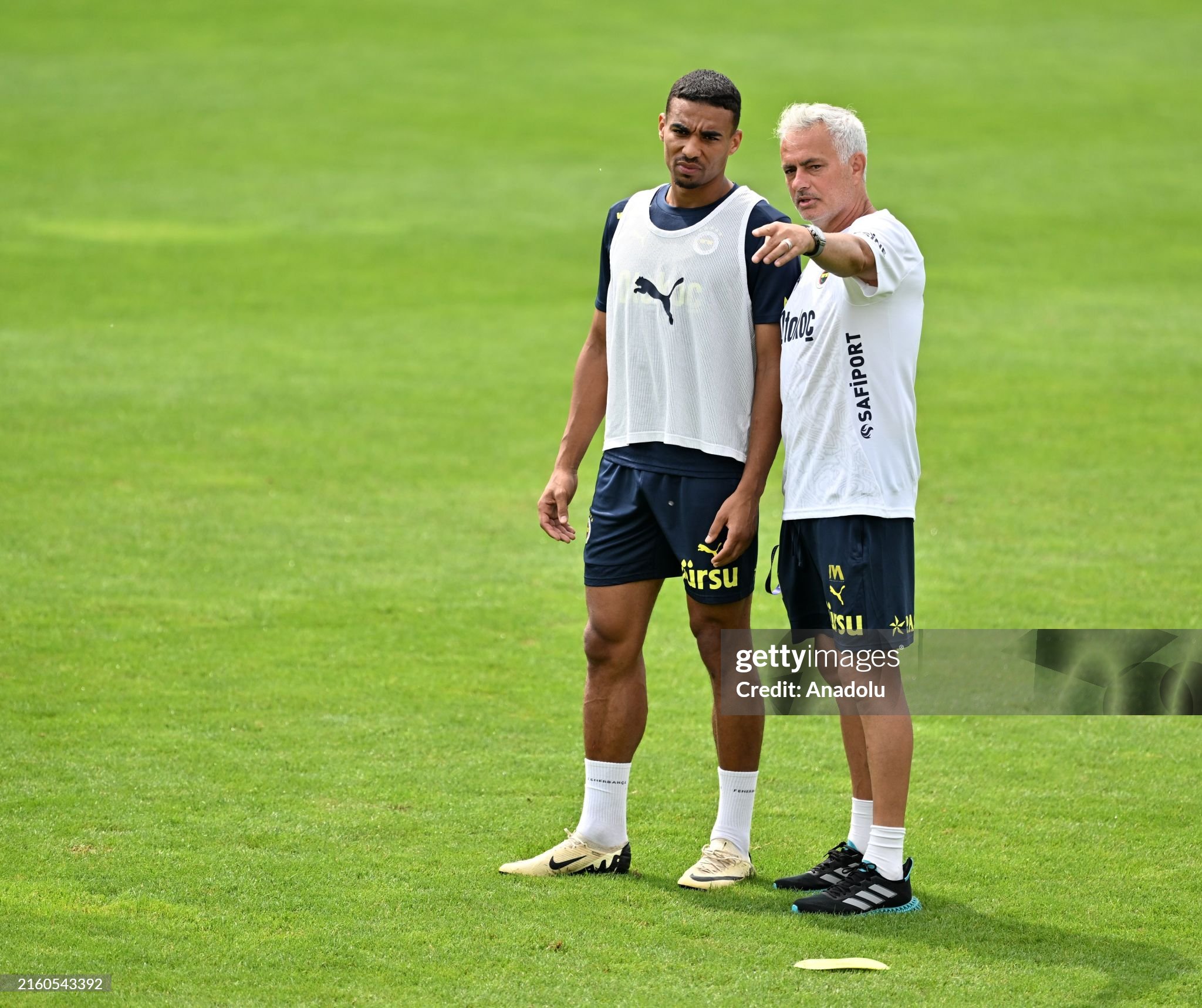 Fenerbahçe manager Jose Mourinho giving tactics to Alexander Djiku during pre-season training in Austria.
