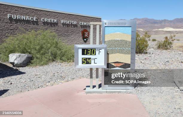 An unofficial thermometer displays the reading 130 degrees Fahrenheit/54 degrees Celsius at Furnace Creek Visitor Center in Death Valley National...