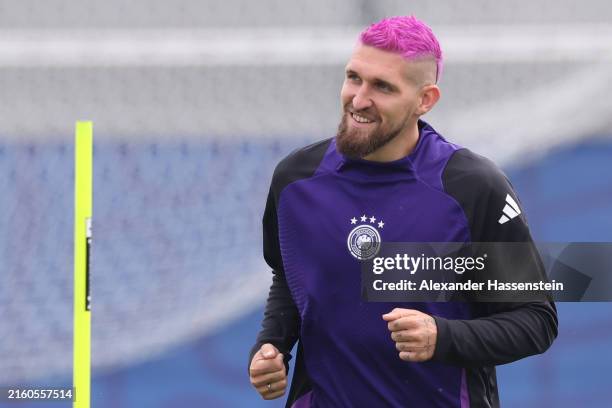 Robert Andrich of Germany looks on with pink hair during a training session at Herzo-Base on July 04, 2024 in Herzogenaurach, Germany.