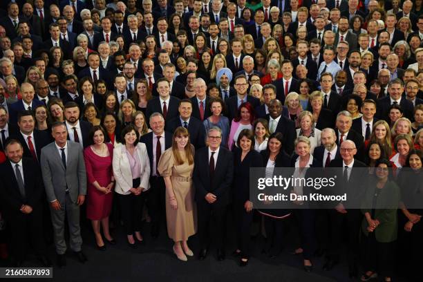 New UK Prime Minister Sir Keir Starmer stands with Labour Party MPs, including some who won seats in the recent general election, at Church House in...