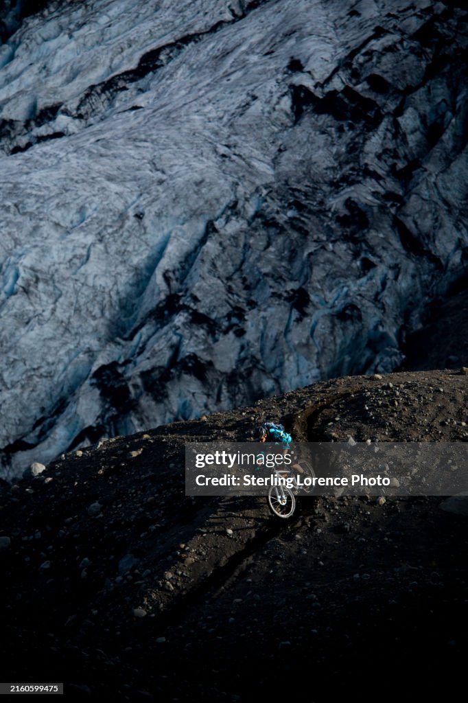Mountain biking in Iceland near a snow capped volcanic glacier