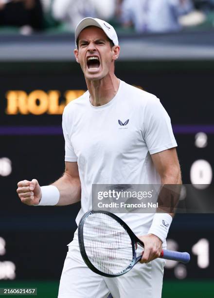Andy Murray of Great Britain celebrates winning a game as he plays with Jamie Murray of Great Britain against Rinky Hijikata and John Peers of...