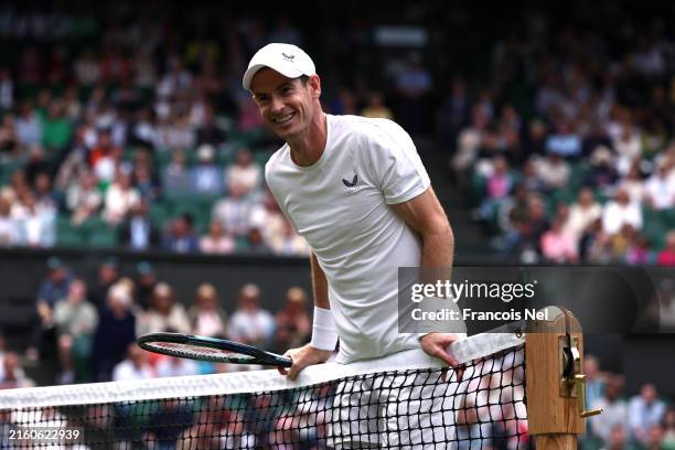 Andy Murray of Great Britain reacts as he plays with Jamie Murray of Great Britain against Rinky Hijikata and John Peers of Australia in the...