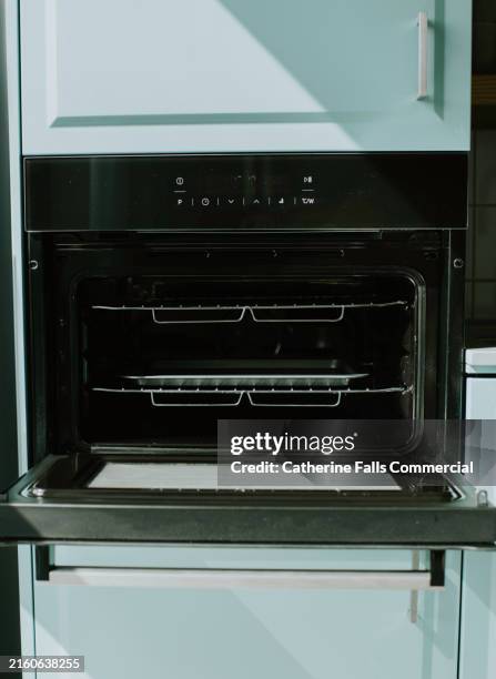 close-up of an open oven - clean oven stock pictures, royalty-free photos & images