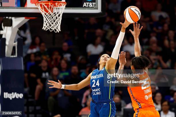 Napheesa Collier of the Minnesota Lynx blocks a shot by Alyssa Thomas of the Connecticut Sun in the third quarter at Target Center on July 04, 2024...