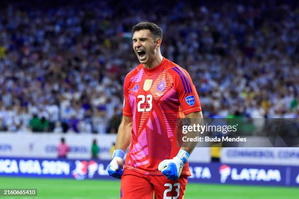 Emiliano Martinez of Argentina saves the second penalty from Alan Minda of Ecuador in the penalty shoot out during the CONMEBOL Copa America 2024...