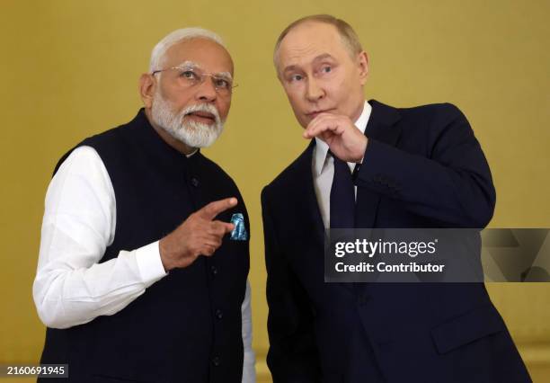 Russian President Vladimir Putin talks to Indian Prime Minister Narendra Modi during their meeting at the Grand Kremlin Palace, on July 9, 2024 in...