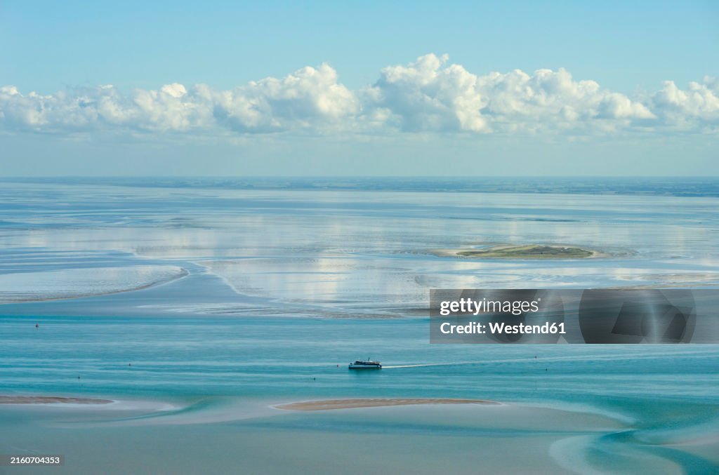 Wadden sea during low tide under cloudy sky in Netherlands