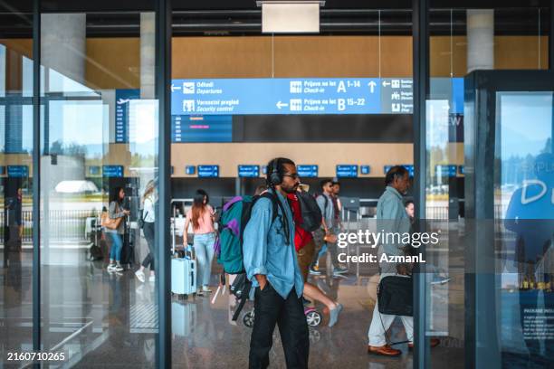 crowded airport departures area - getting out stock pictures, royalty-free photos & images