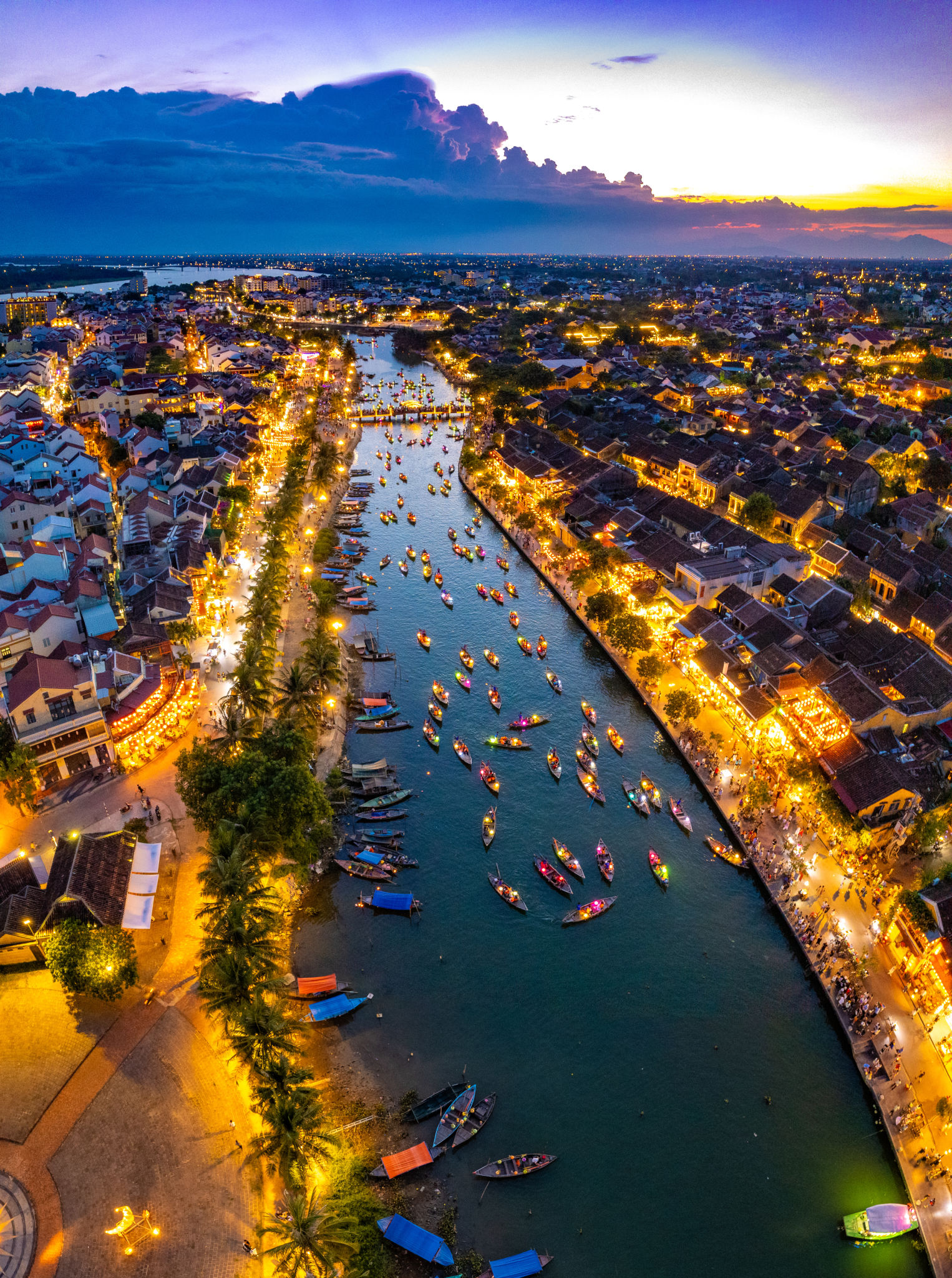 Aerial view of Hoi An Ancient Town with lantern boats on Hoai river, in Hoi An, Vietnam Aerial view of Hoi An Ancient Town with lantern boats on Hoai river, in Hoi An, Vietnam