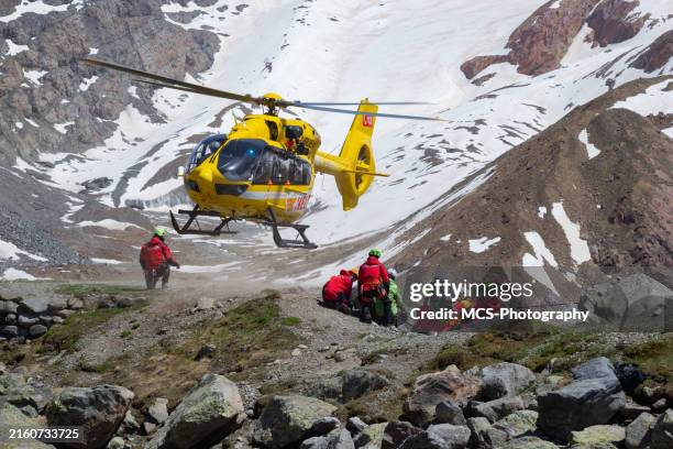 helicopter rescue exercise in italian alps - rescue stock pictures, royalty-free photos & images