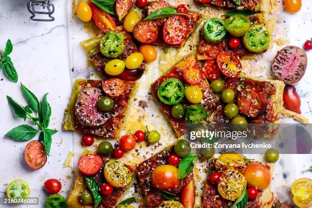 cheese tomato and pesto tart - green tomato stock pictures, royalty-free photos & images