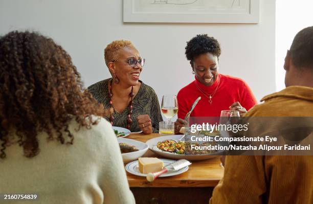 extended family having meal together - social gathering stock pictures, royalty-free photos & images
