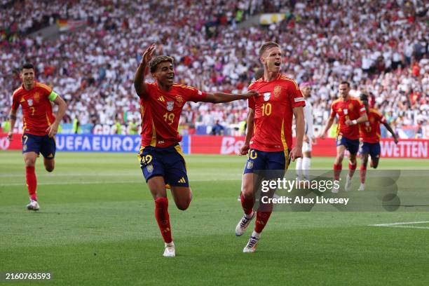 Dani Olmo of Spain celebrates scoring his team's first goal with teammate Lamine Yamal during the UEFA EURO 2024 quarter-final match between Spain...