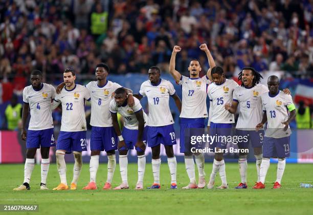 Players of France react in the penalty shoot out during the UEFA EURO 2024 quarter-final match between Portugal and France at Volksparkstadion on...