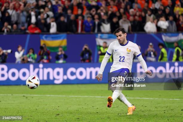 Theo Hernandez of France scores the team's fifth penalty in the penalty shoot out as Diogo Costa of Portugal fails to make a save during the UEFA...