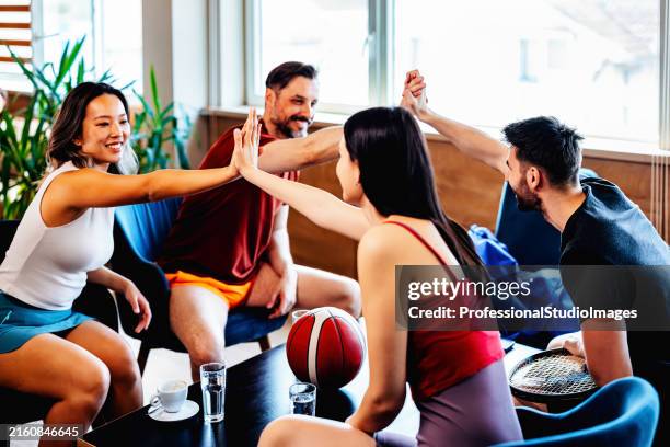 high-five for health and friendship - chinese beauty salon group stock pictures, royalty-free photos & images