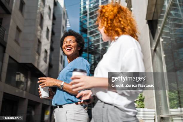 business people engaging in conversation - coffee break stock pictures, royalty-free photos & images