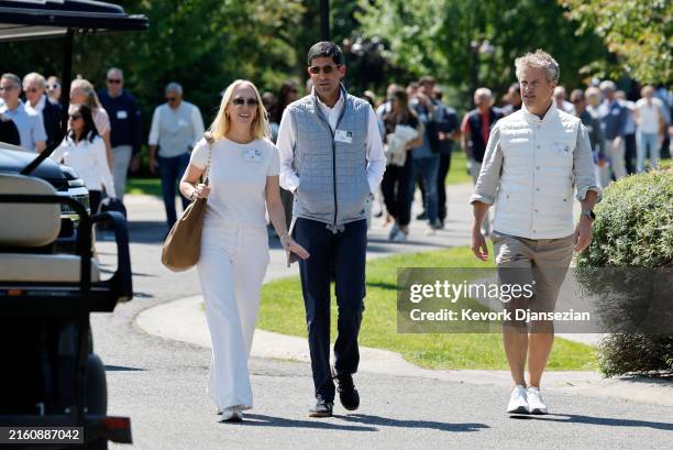 Julia Hartz, CEO of Eventbrite, Kevin Warsh, and Kevin Hartz, former CEO of Xoom, leave after the morning-session at the Allen & Company Sun Valley...
