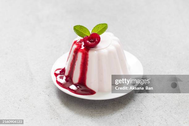 vegan dessert. cherry cream pudding, panna cotta. with cherry sauce. close up - panna cotta stock pictures, royalty-free photos & images