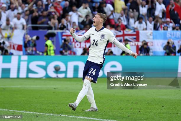 Cole Palmer of England celebrates scoring the team's first penalty in the penalty shoot out during the UEFA EURO 2024 quarter-final match between...