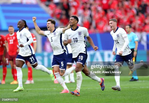 Jude Bellingham of England celebrates following the team's victory in the penalty shoot out after Trent Alexander-Arnold of England scores the team's...