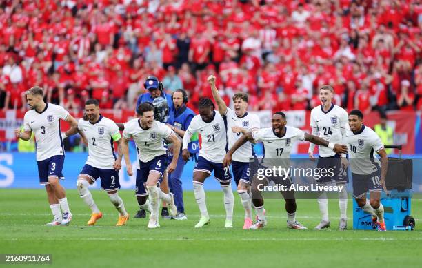 Players of England celebrate after Trent Alexander-Arnold of England scores the team's fifth and winning penalty in the penalty shoot out during the...