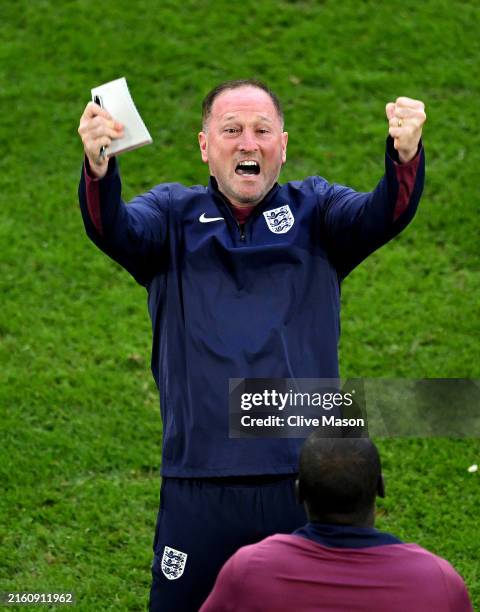 Steve Holland, Assistant Head Coach of England, celebrates following the team's victory in the penalty shoot out during the UEFA EURO 2024...