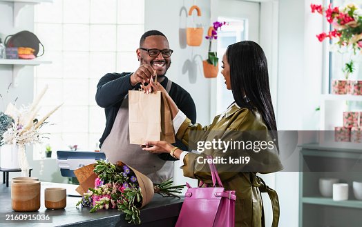 African-American man in gift shop, customer at checkout African-American man in gift shop, customer at checkout