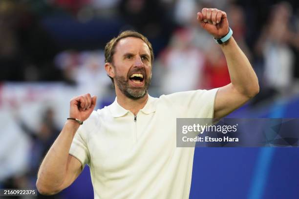 England head coach Gareth Southgate celebrates the victory after the UEFA EURO 2024 quarter-final match between England and Switzerland at Düsseldorf...