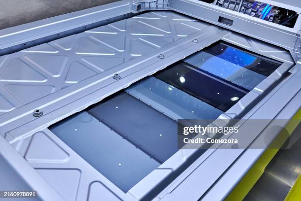 battery pack at electric vehicle chassis - lithium ion battery stock pictures, royalty-free photos & images