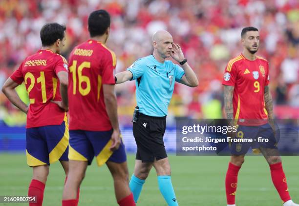 Anthony Taylor Referee has the handball checked by the VAR from Cucurella of Spain during the UEFA EURO 2024 quarter-final match between Spain and...