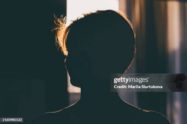 sensual profile shot of unrecognizable woman silhouette. - head silhouette stock pictures, royalty-free photos & images