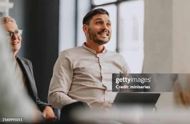 group business meeting with smiling colleagues in office - chairperson stock pictures, royalty-free photos & images