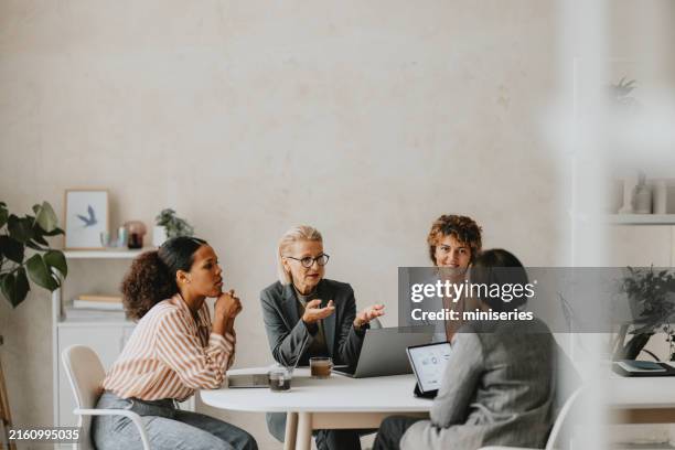 diverse business group in a meeting at office - leader stock pictures, royalty-free photos & images