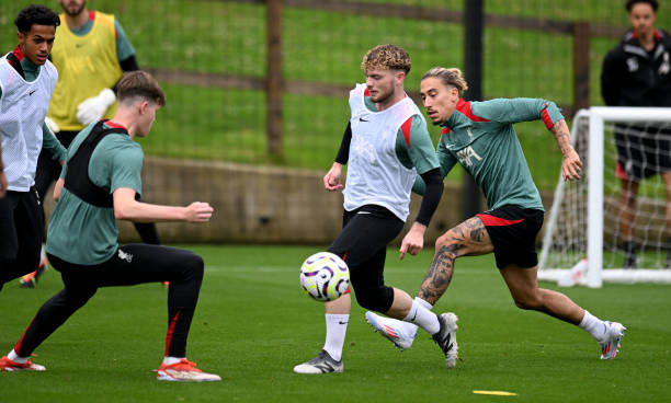 Harvey Elliott, Kostas Tsimikas and James McConnell of Liverpool during a training session at AXA Training Centre on July 07, 2024 in Kirkby, England.