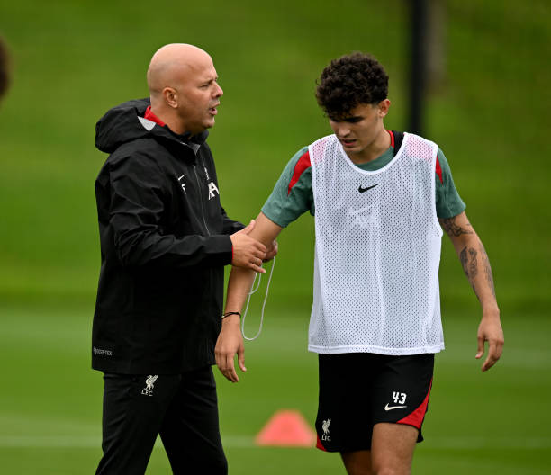Arne Slot head coach of Liverpool with Stefan Bajcetic of Liverpool during a training session at AXA Training Centre on July 07, 2024 in Kirkby,...
