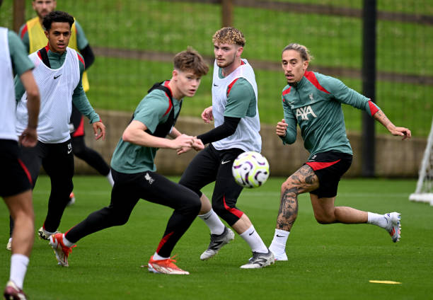 Harvey Elliott, Kostas Tsimikas and James McConnell of Liverpool during a training session at AXA Training Centre on July 07, 2024 in Kirkby, England.