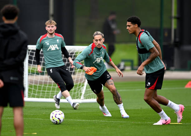 Kostas Tsimikas and Jarell Quansah of Liverpool during a training session at AXA Training Centre on July 07, 2024 in Kirkby, England.