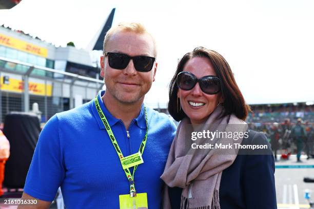 Sir Chris Hoy and Sarra Hoy pose for a photo on the grid during the F1 Grand Prix of Great Britain at Silverstone Circuit on July 07, 2024 in...