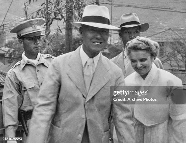 Korean politician Syngman Rhee, President of South Korea, and his wife, Francesca Donner, First Lady of South Korea, at the polling station during...