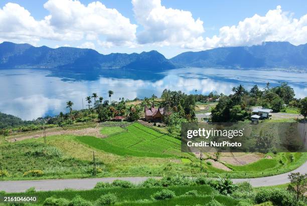 An aerial view is showing Lake Maninjau in Agam Regency, West Sumatra, Indonesia, on July 11, 2024. The Maninjau caldera is being formed by a...