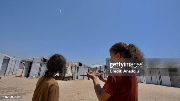 Children spend time at the 'Orphan City' camp established by a charity organization for Palestinian children who lost their entire families as a...